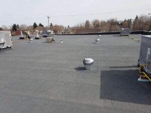 Silverback Torch On Systems Ltd. preparing work area for commercial flat roof membrane installation